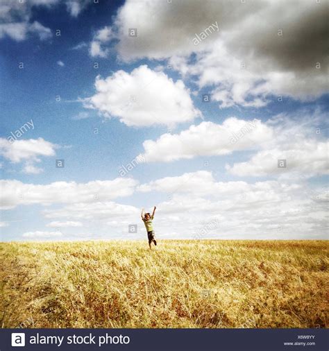 Boys Running Through Field High Resolution Stock Photography And Images