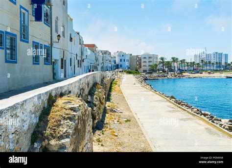 The pleasant walk in shade of houses along the coast of the sea in Mahdia, Tunisia Stock Photo ...