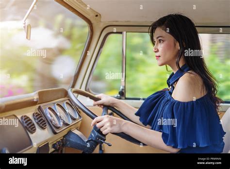 Young Woman Driving A Vintage Car Stock Photo Alamy