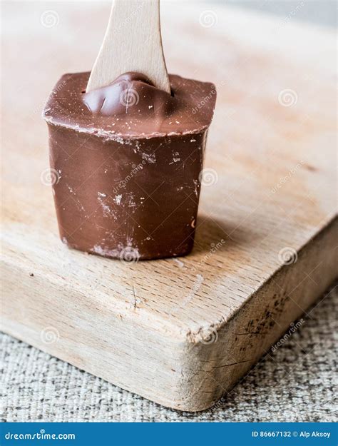 Milky Chocolate with Wooden Stick Stock Photo - Image of chocolate