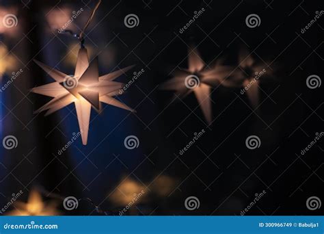 Christmas Shining Star With Warm Light On A Black Backgroundchristmas