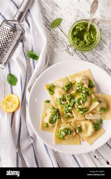 Italian Spinach Ravioli With Pesto Sauce Parmesan And Cedar Nuts Stock