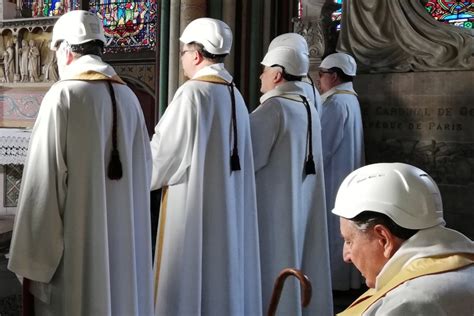 Priests wear hard hats in first mass in Notre Dame since fire | Metro News