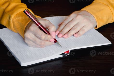 Woman Writing In Blank Notebook Close Up Of Hand Holding Pen 10304923