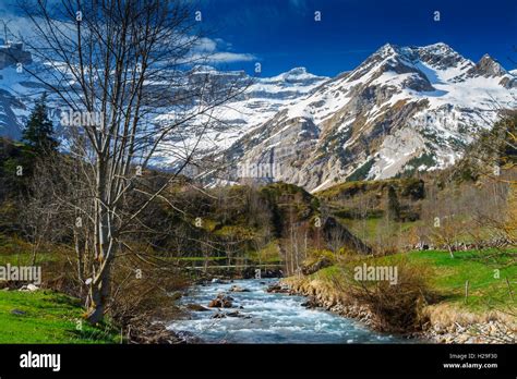 Snow-covered mountains and river Stock Photo - Alamy