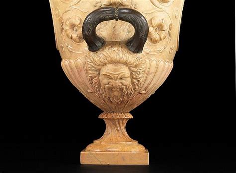 An Ornate Vase With A Lion Head On It S Face And Two Horns Sticking Out