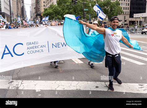 New York New York June 04 Participants Holding Israeli Flags And Signs March Up Fifth Avenue