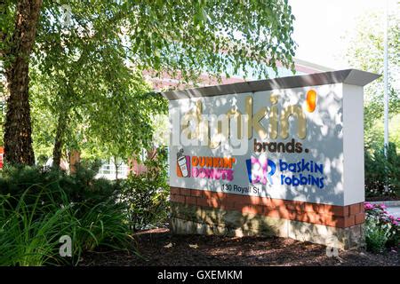 A logo sign outside of the headquarters of Dunkin' Brands Group, Inc ...