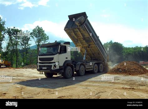 Big Truck Tipper At Work Big Tipper Truck Unloading Land On The Site