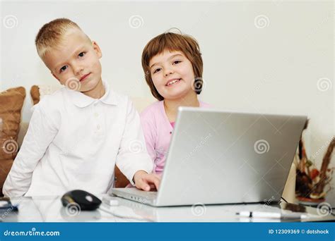 Children Playing Games On Laptop Computer Stock Image Image Of