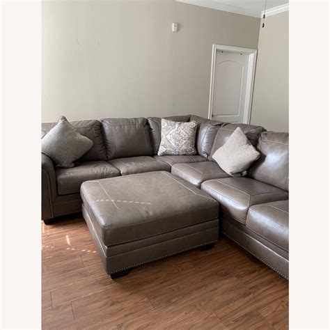 Leather Ashley Furniture Sectional With Ottoman - AptDeco