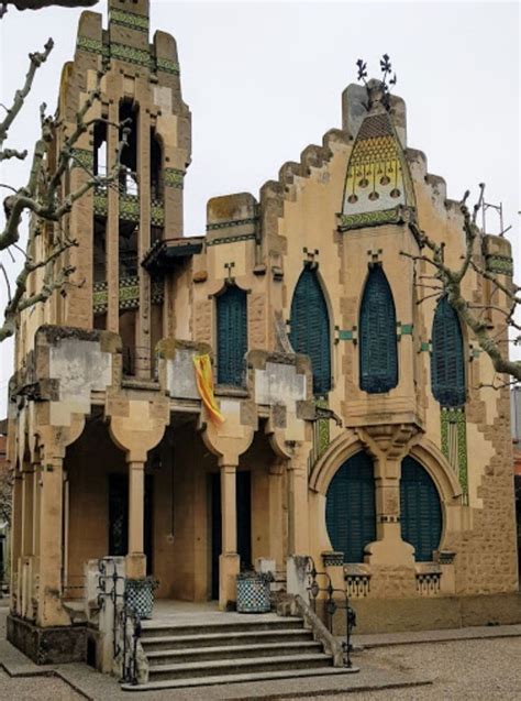 An Old Building With Many Windows And Stairs