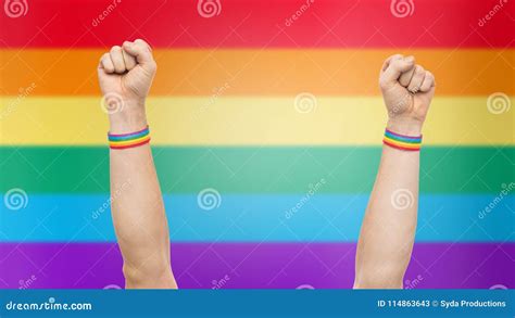 Hands With Gay Pride Rainbow Wristbands Shows Fist Stock Image Image