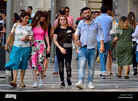 People walking on the Fountains Square in Baku Stock Photo - Alamy