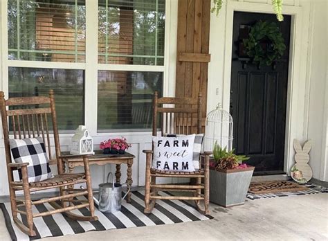 Two Rocking Chairs Sitting On The Front Porch