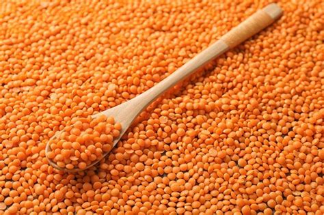 Premium Photo Wooden Spoon On Healthy Lentils