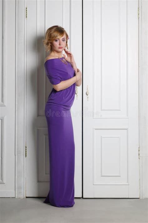 Woman In Long Purple Dress With Flower In Her Hair Stock Photo Image