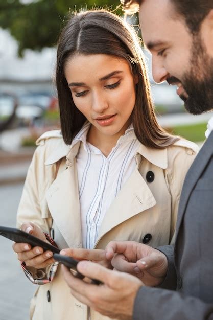 Premium Photo Photo Of Serious Office Workers Man And Woman Holding