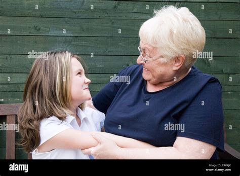 Granddaughter Holds Her Grandmother Stock Photo Alamy