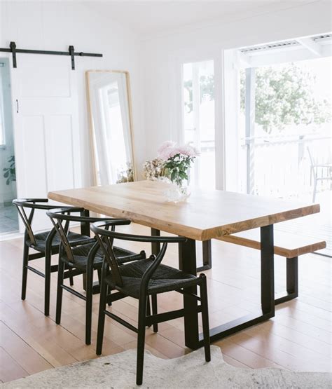 elegant black dining table  oak chairs modern timeless dining