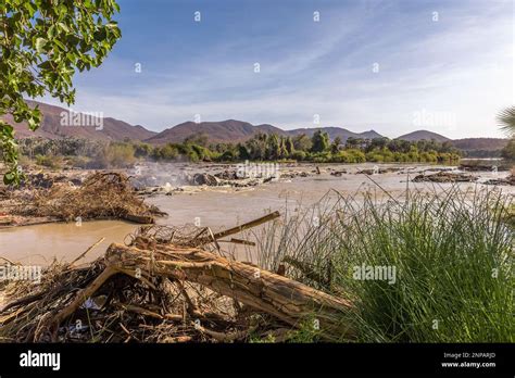 Landscape On The Banks Of The Kunene River The Border River Between