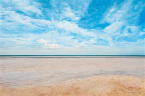 Premium AI Image | A Beach With A Blue Sky