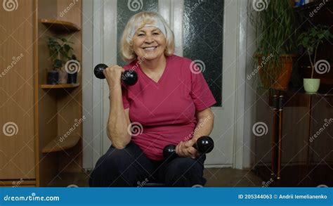 Senior Mature Grandmother Woman Doing Weightlifting Training Workout