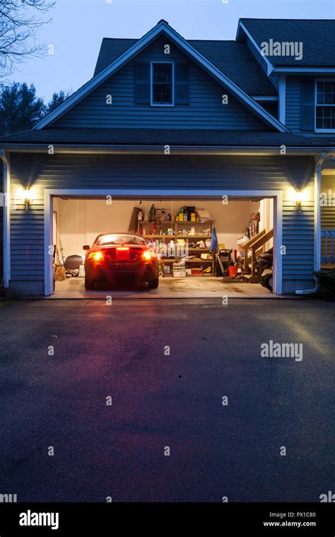 Open Garage Doors In A Suburban Home Usa Stock Photo Alamy