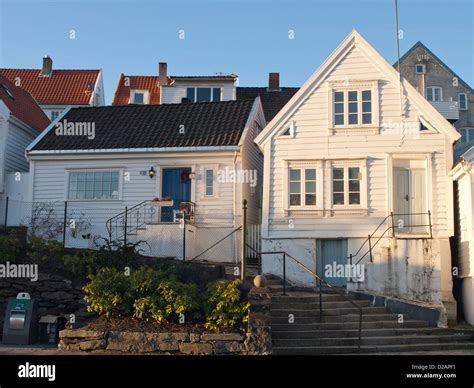 White Wooden Paneled Houses In Old Stavanger Norway A Tourist