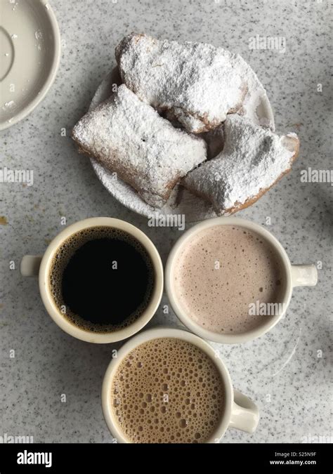 Beignets and coffee Stock Photo - Alamy