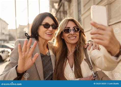 Two Gorgeous Adult Caucasian Women Take Selfie On Phone For Social