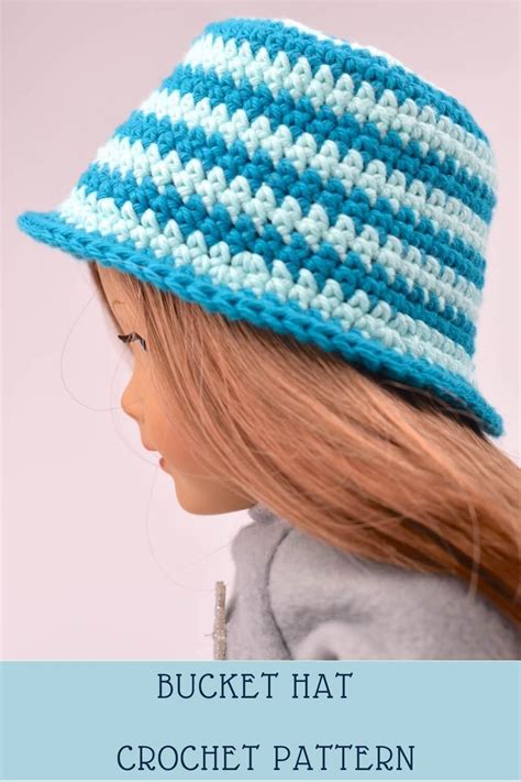 A Doll Wearing A Blue And White Crochet Hat With Text Overlay That