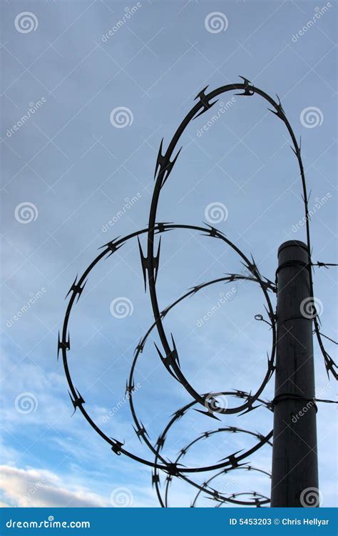 Razor Wire Fence Silhouette Stock Photos - Image: 5453203