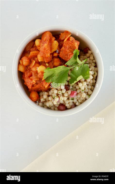 moroccan chicken tagine with giant couscous Stock Photo - Alamy