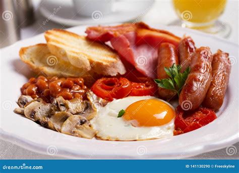 Full English Or Irish Breakfast With Sausages Bacon Eggs Tomatoes