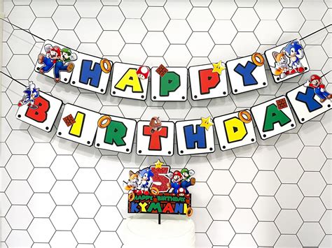 This Super Combo Of Mario And Sonic Cake Topper And Happy Birthday