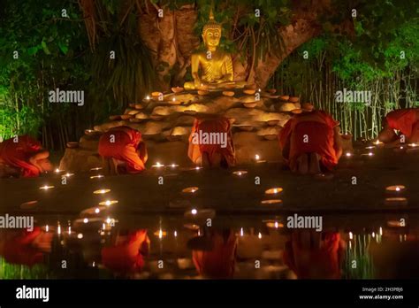 Visakha Puja Day Vesak Buddhist Monk Fire Candles And Pray To The Buddha In Chiang Mai