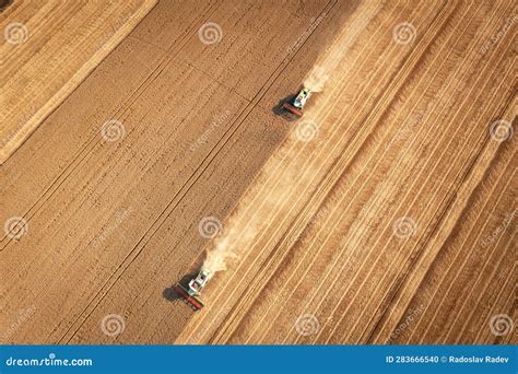 Aerial View Combine Harvester Harvesting On The Field Stock Photo