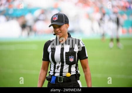 NFL back judge Robin DeLorenzo walks on the field during an NFL ...