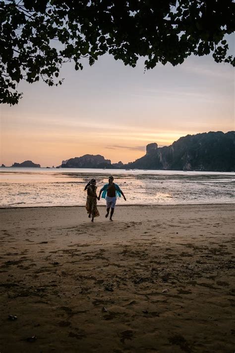 Couple During Sunset On The Beach Krabi Thailand Men And Woman