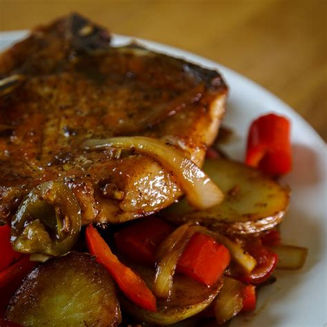 Delicious Pork Chops With Potatoes Onions Bell And Cherry Vinegar