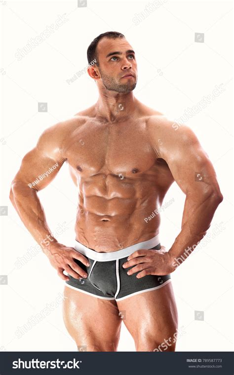 Muscular Bodybuilder Posing Shirtless Demonstrating Well