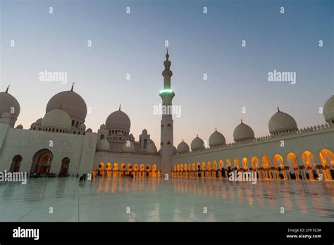 A View Of Domes Lighted Arches And A Minaret At The Sheikh Zayed