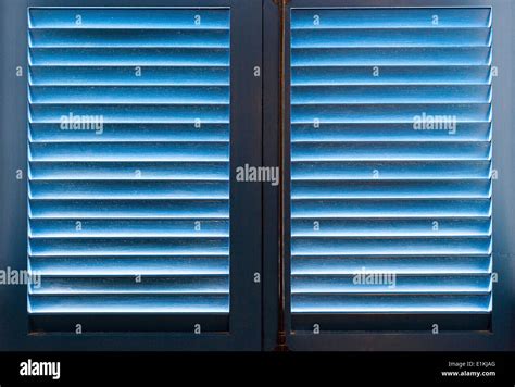 Blue window shutters Stock Photo - Alamy