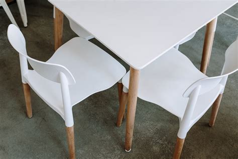 White Plastic Chair Beside Table · Free Stock Photo