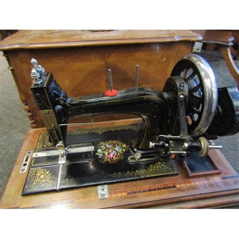 A Walnut Cased Singer Sewing Machine