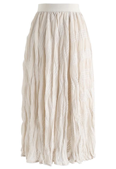 Slanted Embroidered Pleated Midi Skirt In Cream Skirt Bottoms