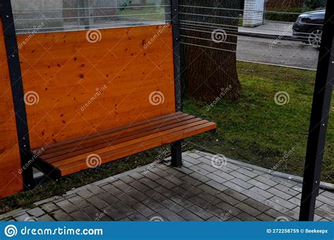 City Bus Stop. Glass Shelter with Integrated Wooden Bench Stock Image ...