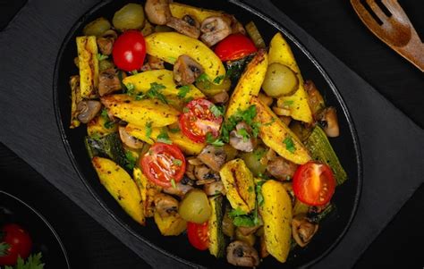 Premium Photo Hot Vegetable Salad In A Plate On A Wooden Table