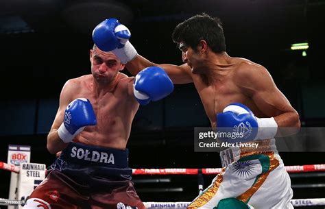 Vijender Singh Lands A Right Shot On Andrzej Soldra During The News